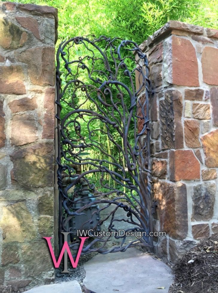 custom wrought iron gate in Dallas, TX, made to look like twigs and vines. by Izabela Wojcik